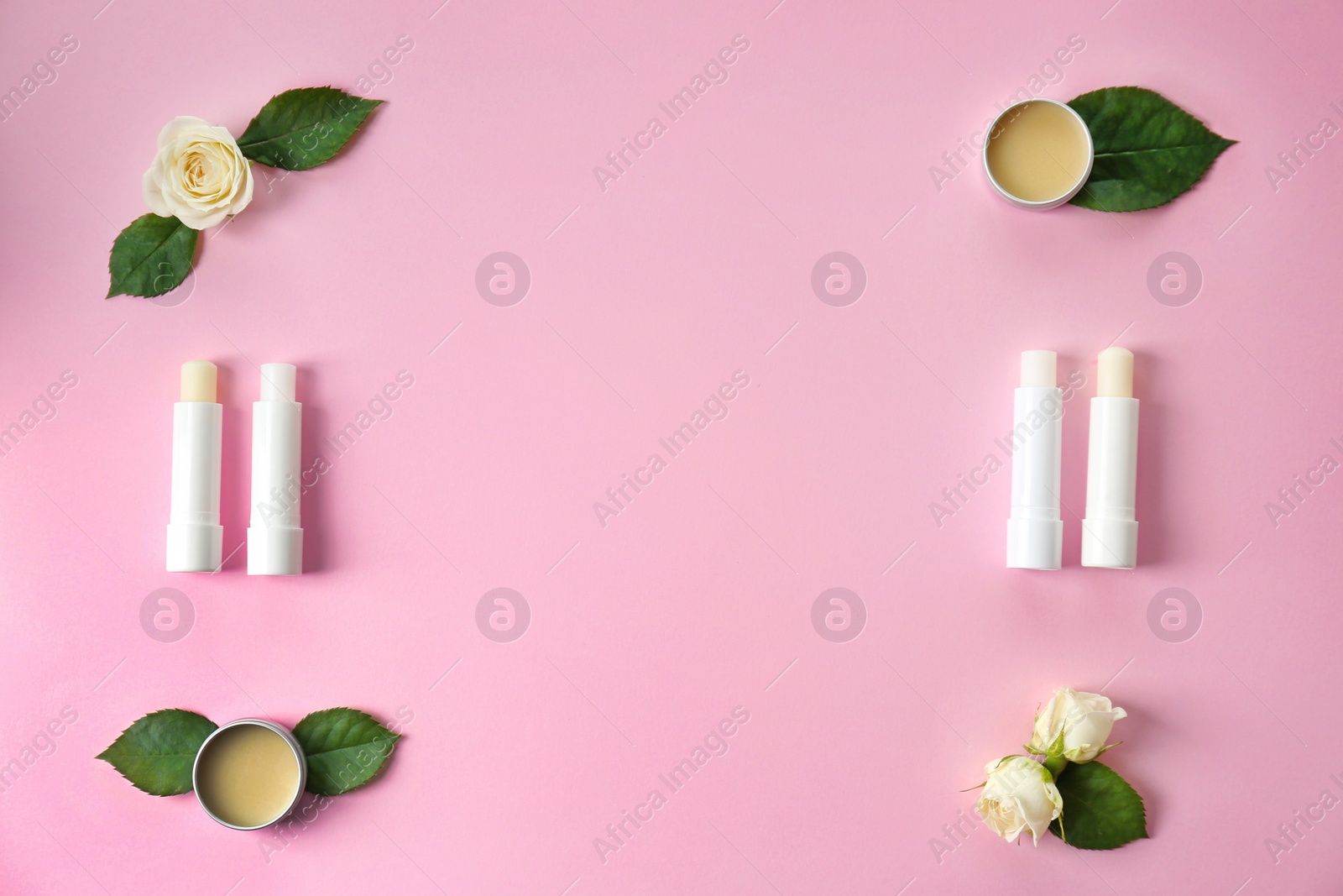 Photo of Flat lay composition with hygienic lipsticks and balms on color background