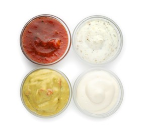 Photo of Many different sauces in bowls on white background, top view