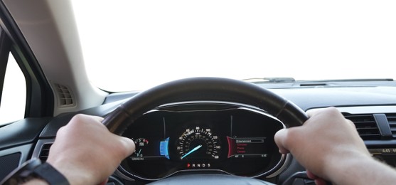 Photo of Man driving car with speedometer on dashboard, closeup