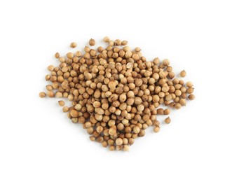 Heap of dried coriander seeds on white background, top view