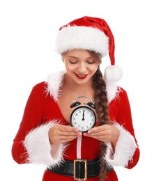 Beautiful Santa girl with alarm clock on white background. Christmas eve