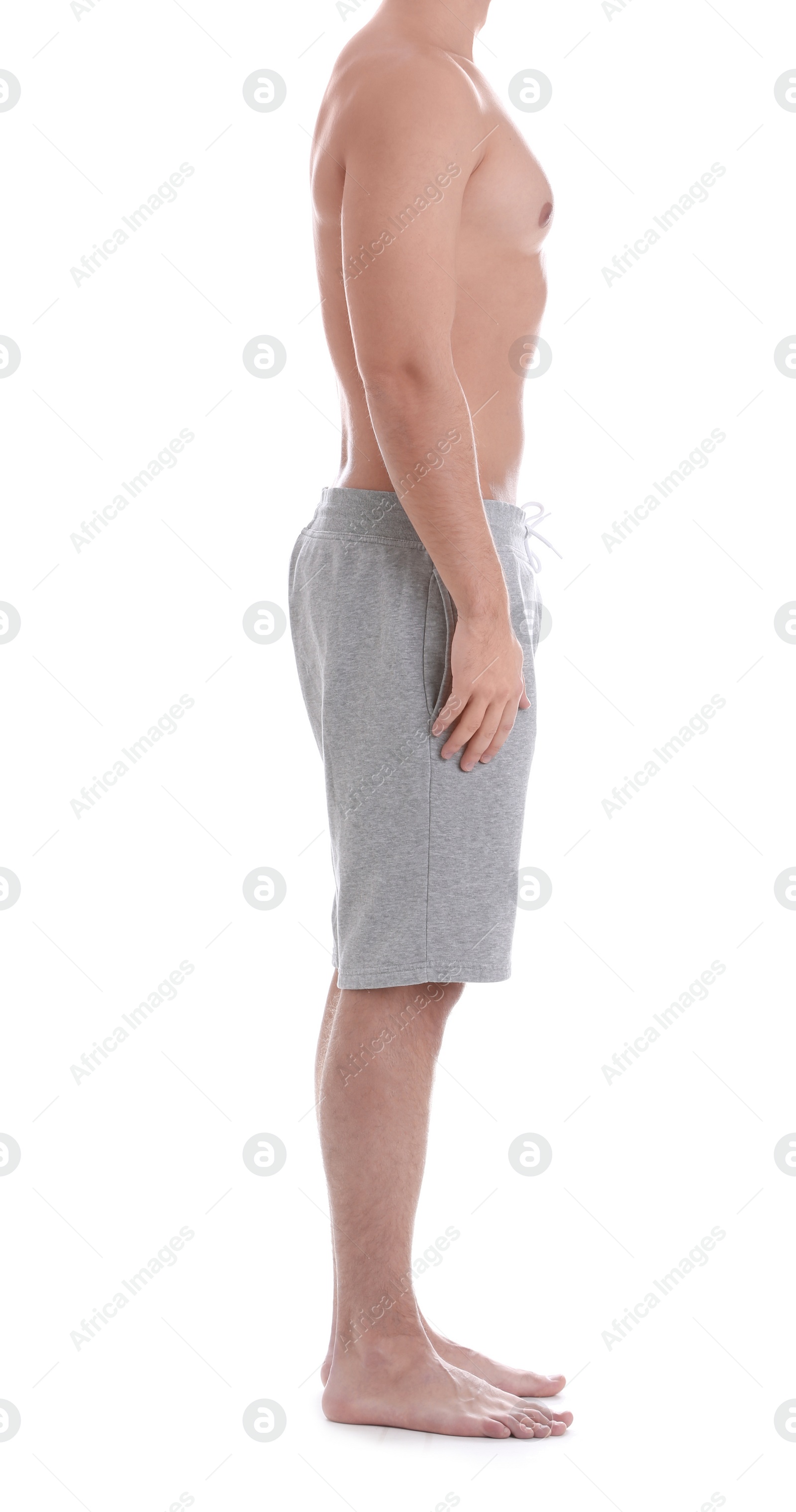 Photo of Young athletic man on white background, closeup. Weight loss