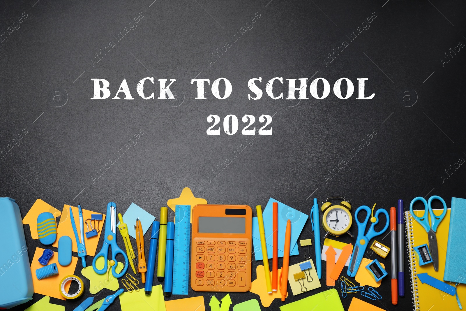 Image of Back to school 2022. Flat lay composition with different stationery on blackboard