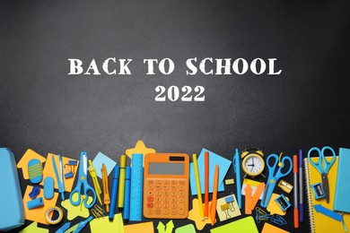 Image of Back to school 2022. Flat lay composition with different stationery on blackboard