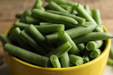 Photo of Fresh green beans in bowl closeup view