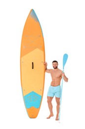 Happy man with orange SUP board and paddle on white background