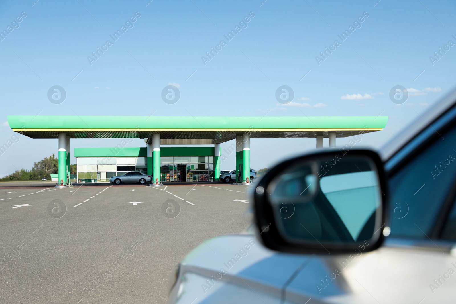 Photo of Modern car driving to gas station, closeup