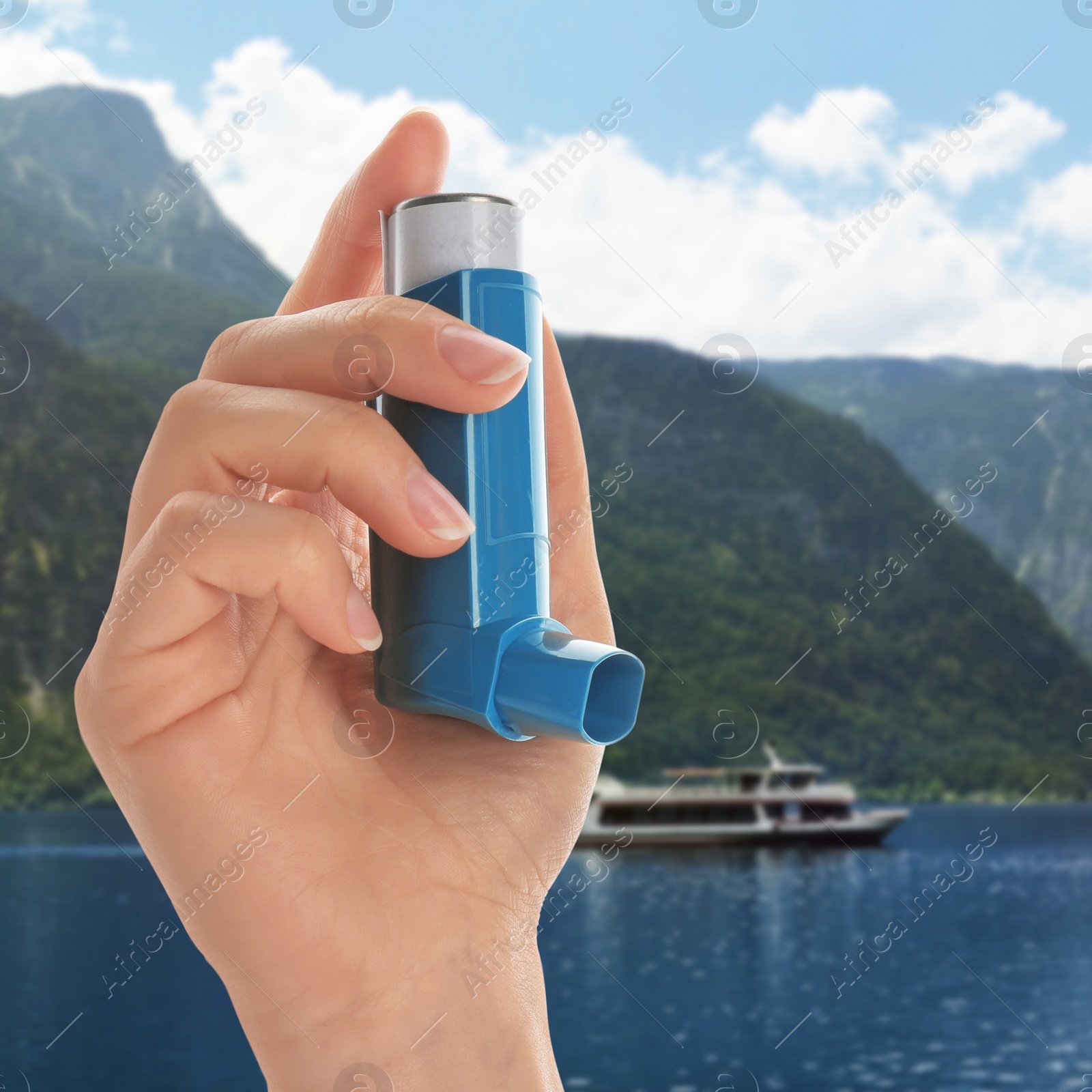 Image of Woman with asthma inhaler near lake, closeup. Emergency first aid during outdoor recreation