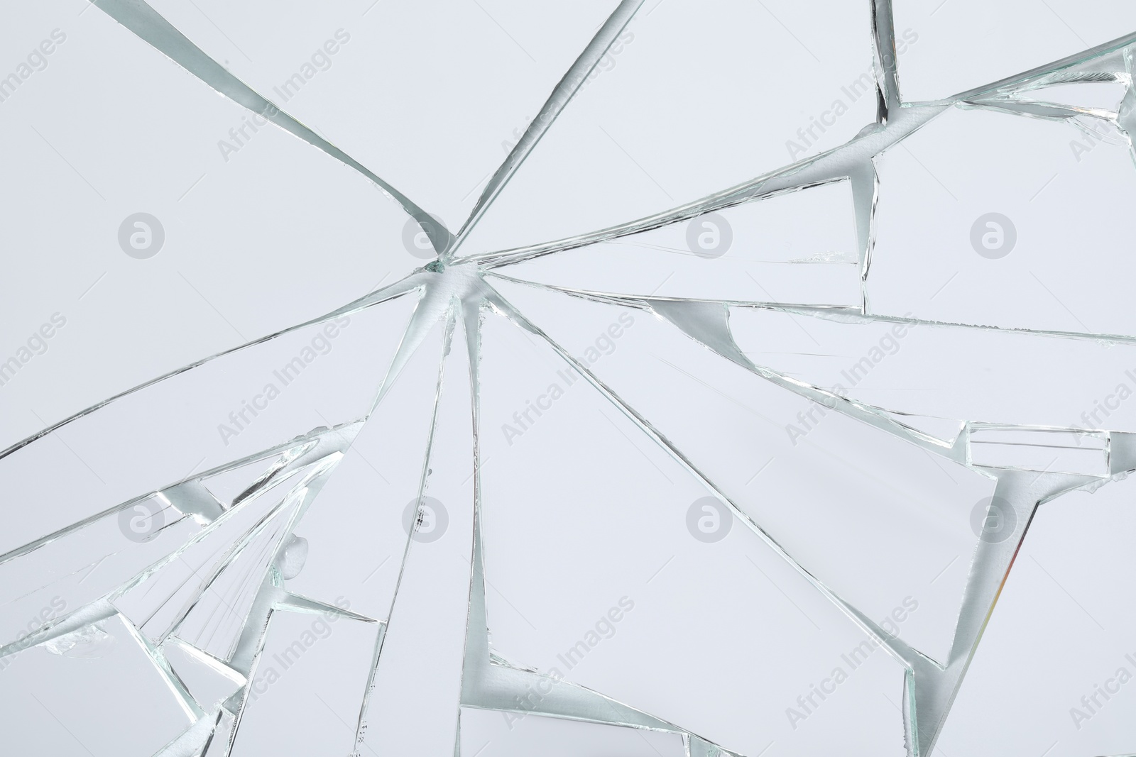 Photo of Shards of broken mirror on white background, top view