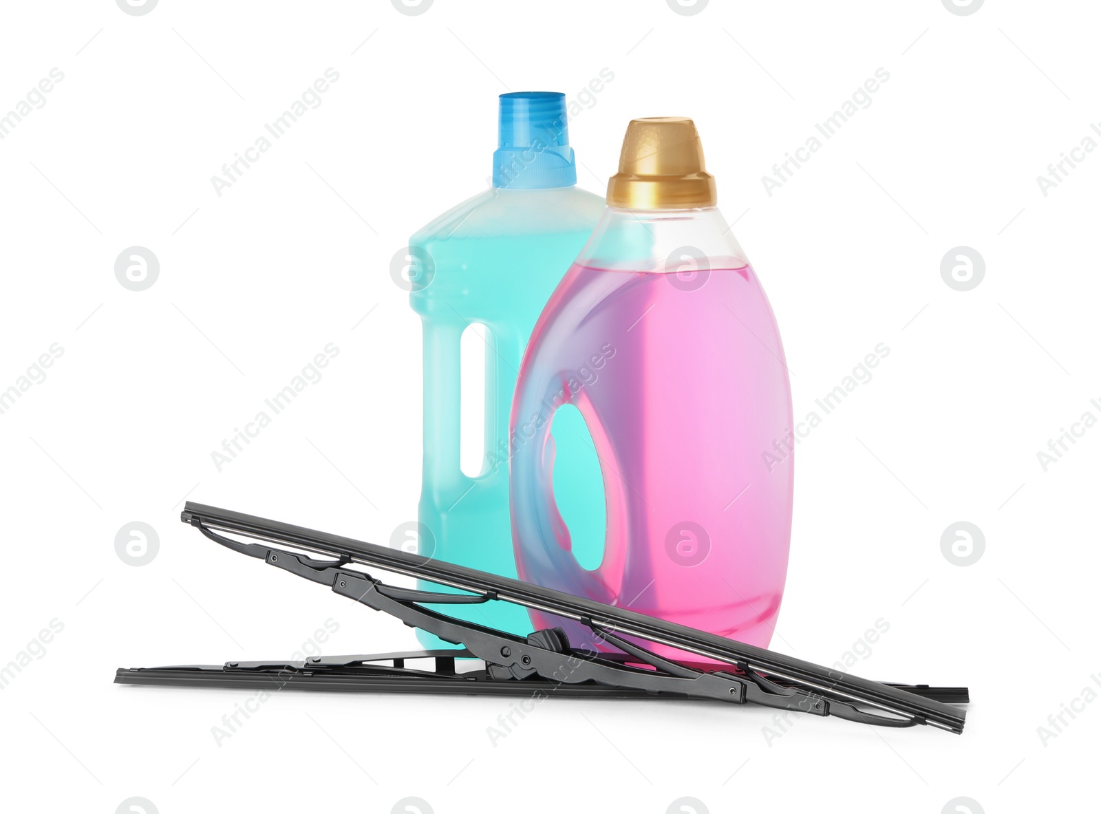 Photo of Bottles of windshield washer fluids and wipers on white background