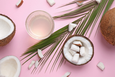 Flat lay composition with coconut oil on pink background