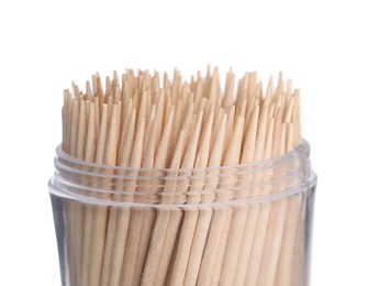 Photo of Wooden toothpicks in holder on white background, closeup