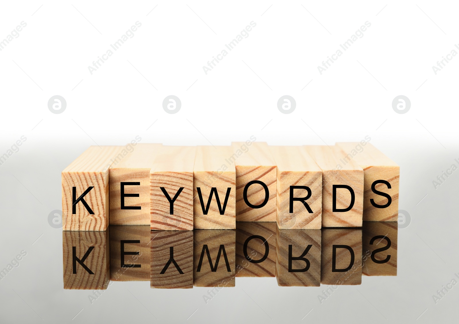 Photo of Word KEYWORDS made of wooden blocks on white background