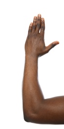 African-American man showing hand gesture on white background, closeup