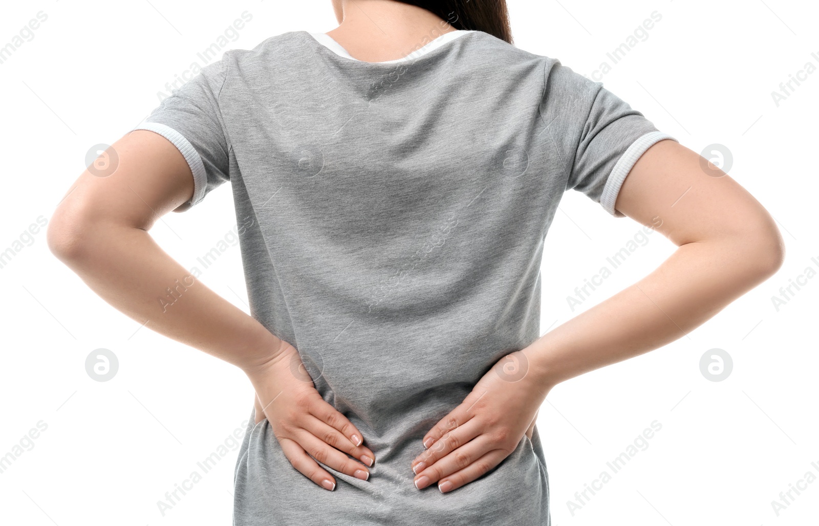 Photo of Young woman suffering from back pain on white background