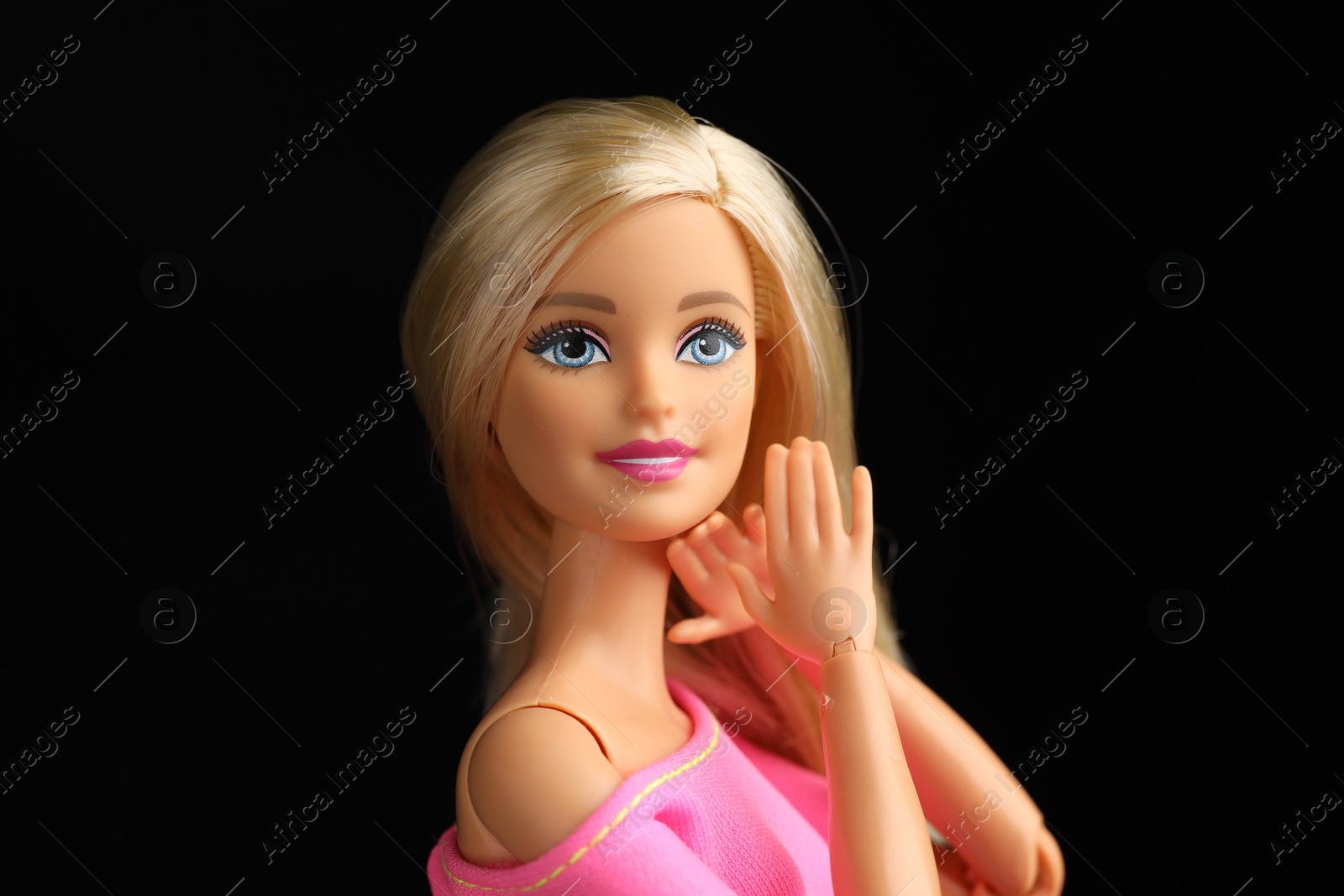 Photo of Mykolaiv, Ukraine - September 1, 2023: Beautiful Barbie doll on black background
