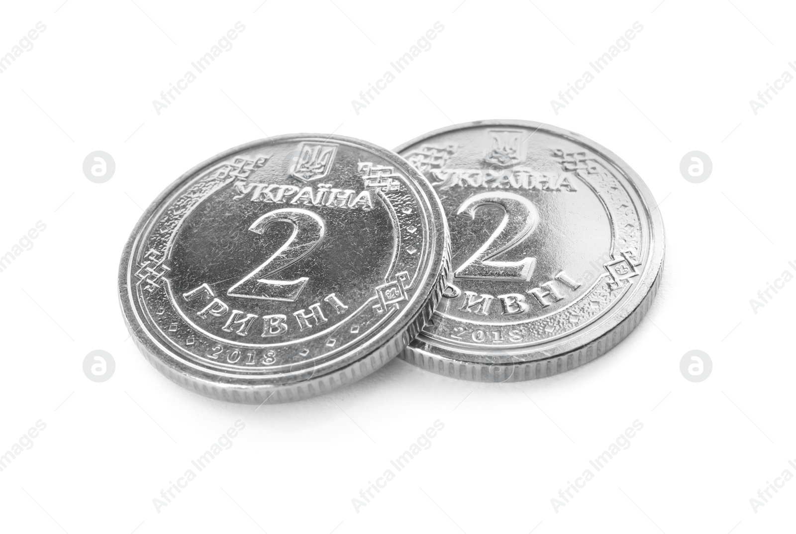 Photo of Ukrainian coins on white background. National currency