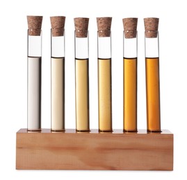 Test tubes with brown liquid in stand on white background