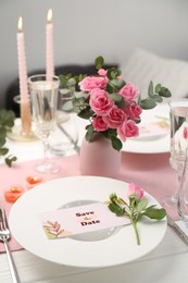 Romantic table setting with flowers and candles