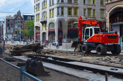 Photo of Road repair machine working on city street