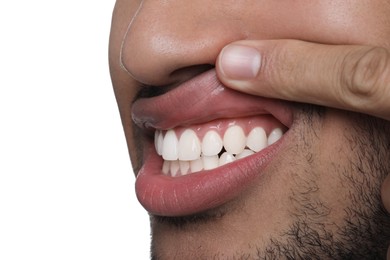 Man showing healthy gums on white background, closeup. Space for text