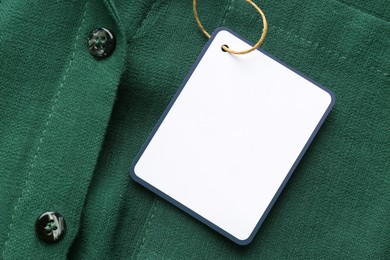 Blank tag on shirt, top view. Space for text