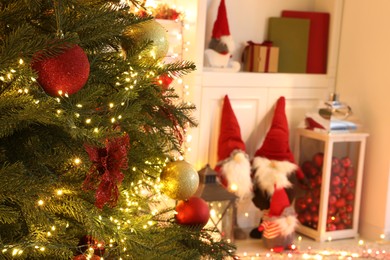 Photo of Beautiful Christmas tree and festive decor in room