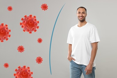 Image of Man with strong immunity surrounded by viruses on grey background