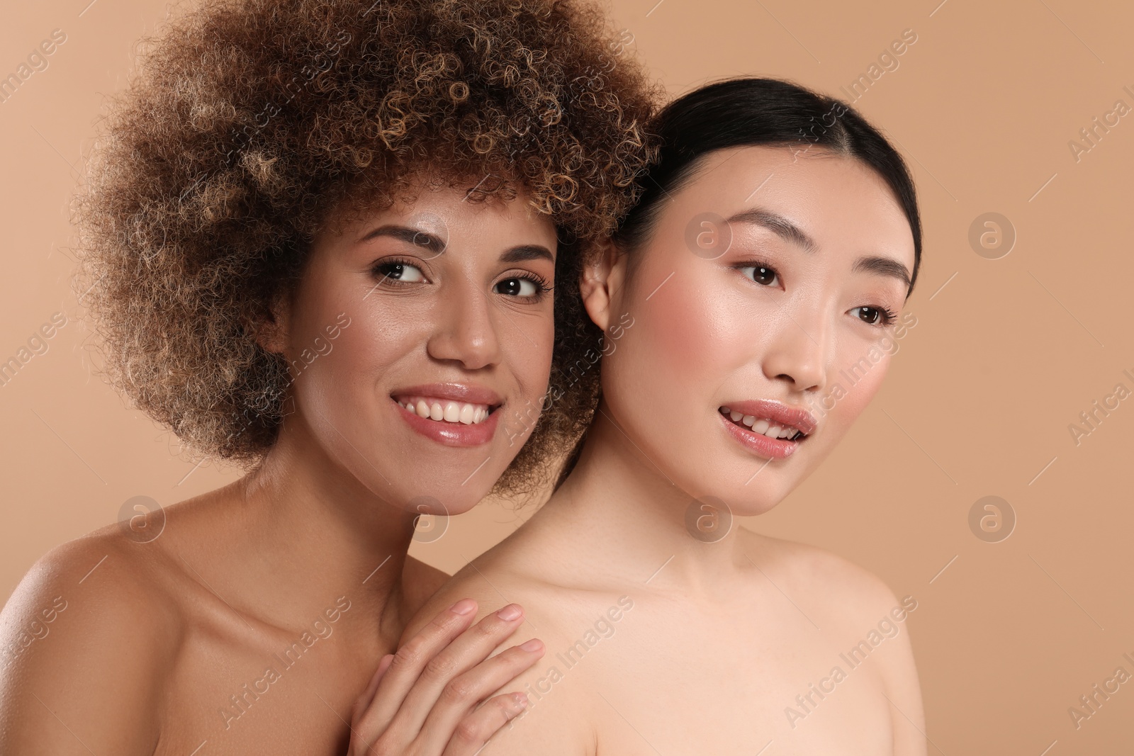 Photo of Beautiful young women with healthy skin on beige background