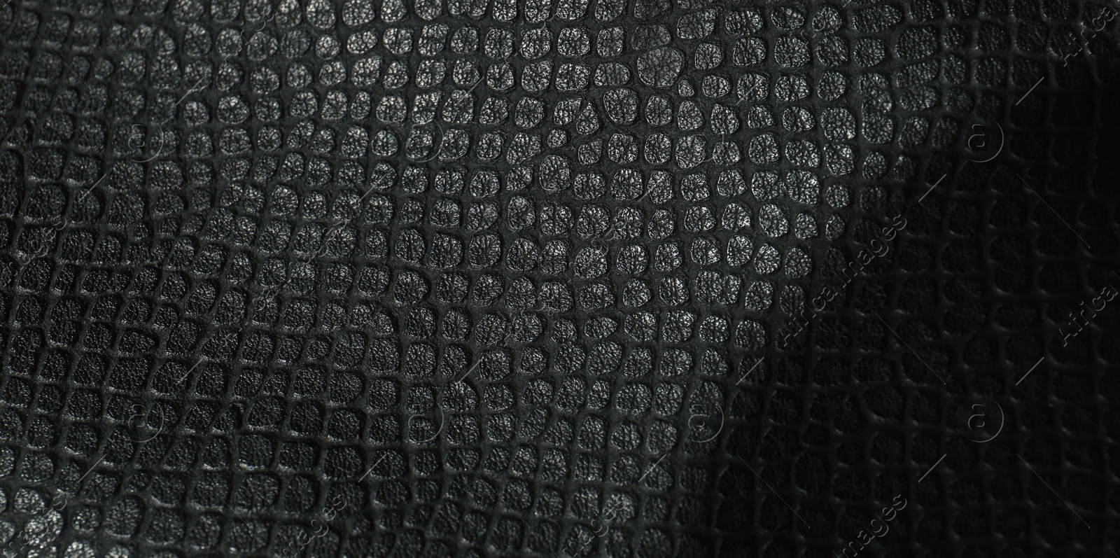 Photo of Black natural leather as background, top view