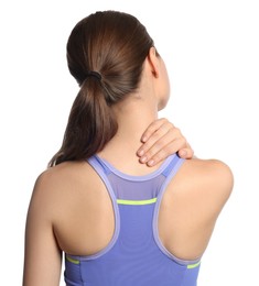 Photo of Young woman suffering from neck pain on white background, back view