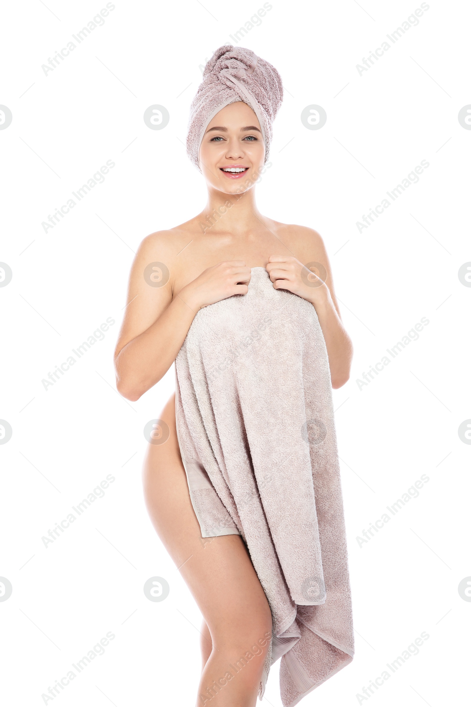 Photo of Portrait of young pretty woman with towels on white background