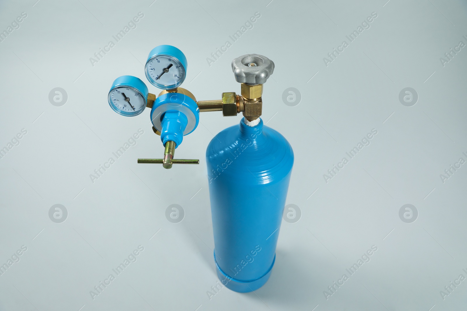 Photo of Oxygen tank on light grey background. Medical equipment