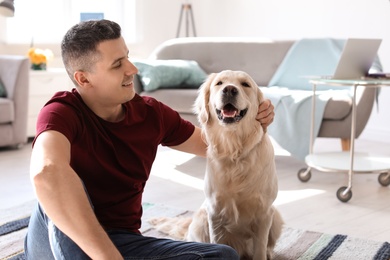 Photo of Portrait of owner with his friendly dog at home