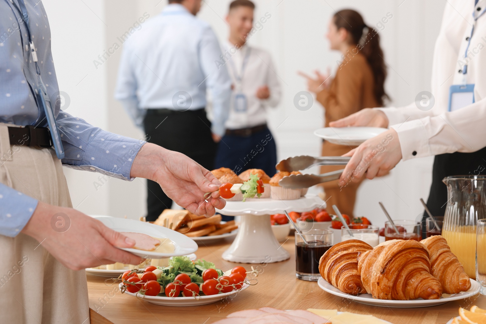 Photo of Coworkers having business lunch in restaurant, closeup