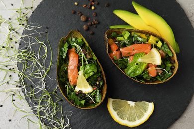 Photo of Delicious salmon with spinach served on grey table, flat lay