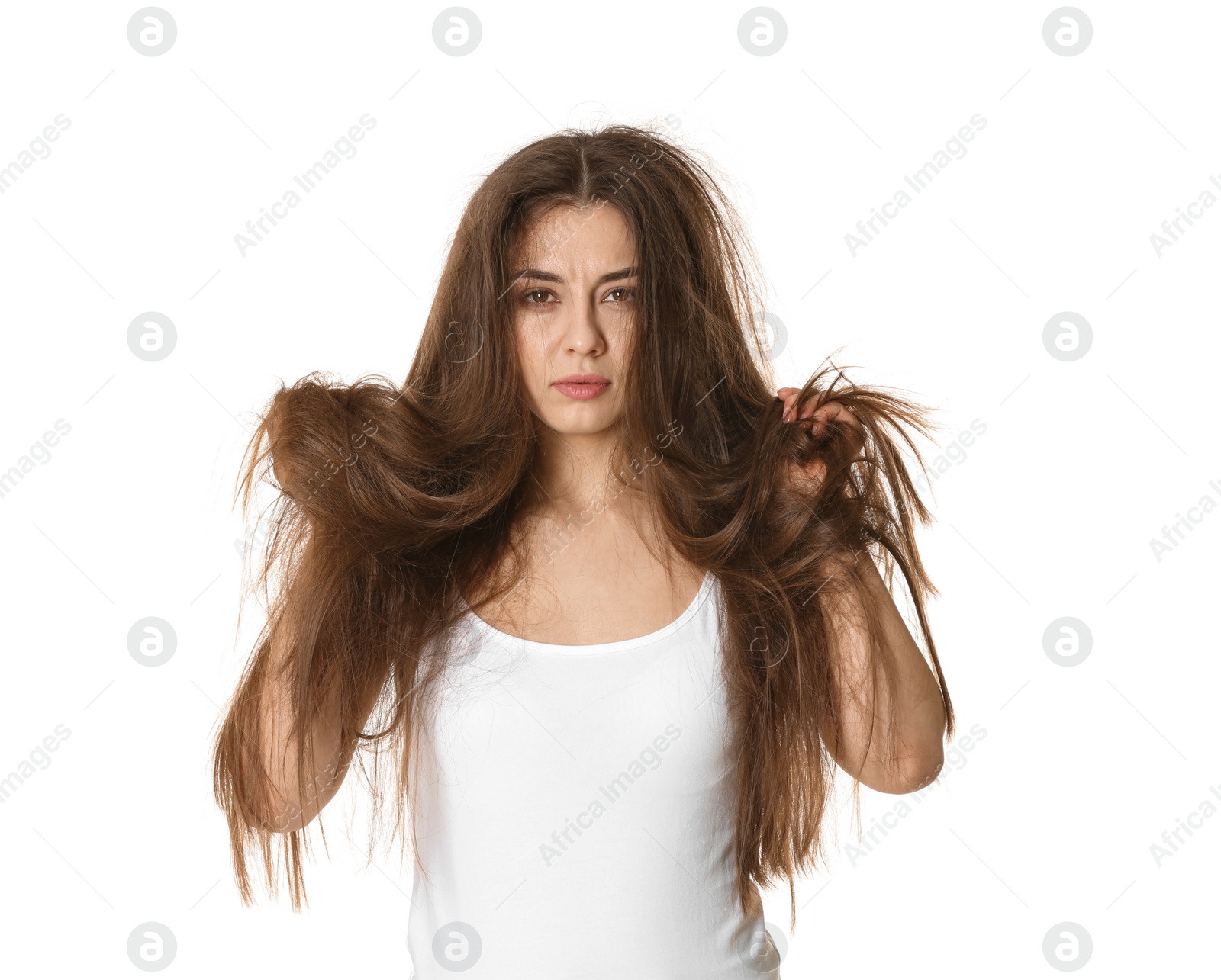 Photo of Emotional woman with tangled hair on white background