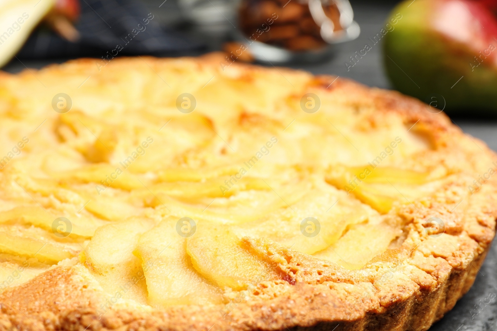 Photo of Delicious sweet pear tart on table, closeup