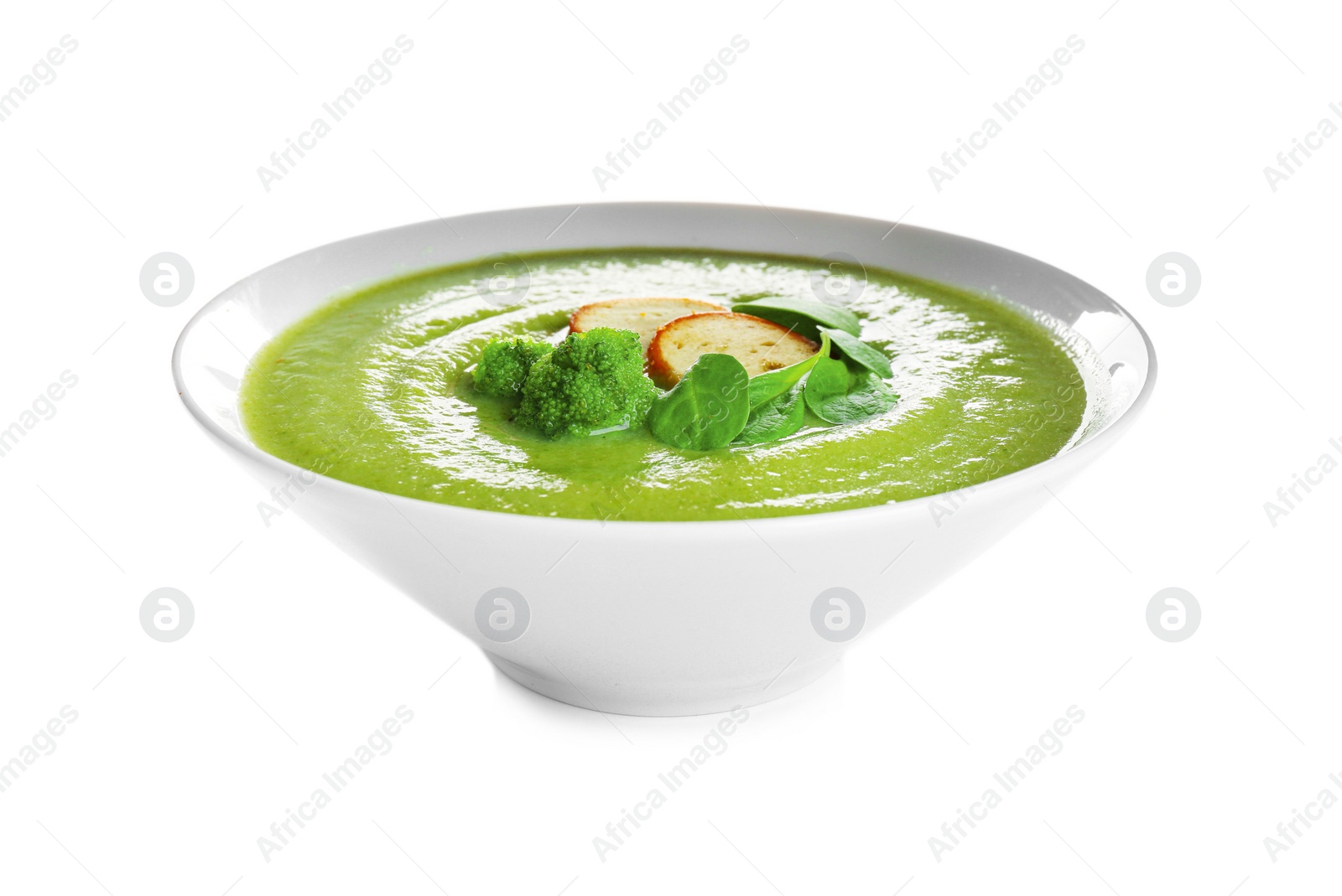 Photo of Bowl of broccoli cream soup with croutons on white background