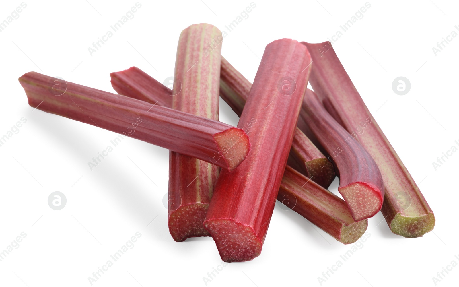 Photo of Stalks of fresh ripe rhubarb isolated on white