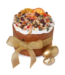 Photo of Traditional Easter cake with dried fruits and painted eggs on white background