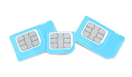 Photo of Light blue SIM cards on white background, top view