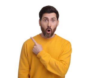 Photo of Surprised man pointing at something on white background