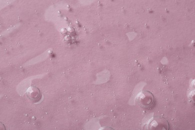 Photo of Cosmetic serum on pink background, top view