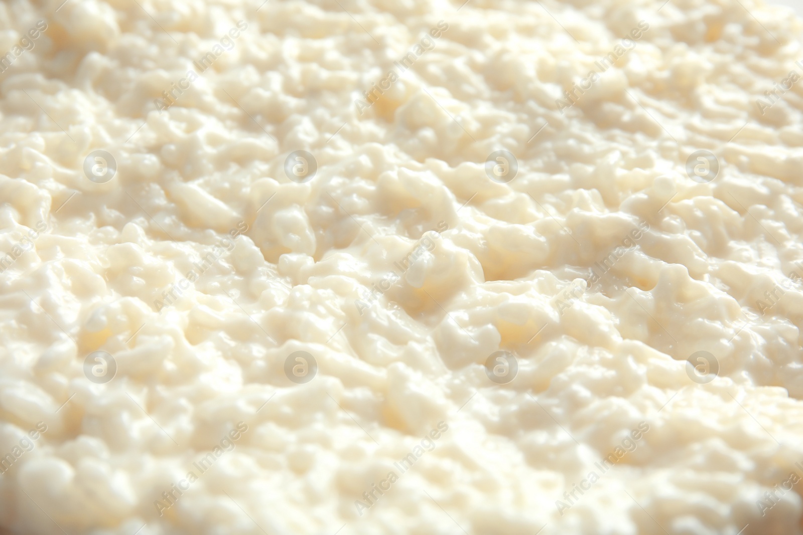 Photo of Delicious creamy rice pudding as background, closeup