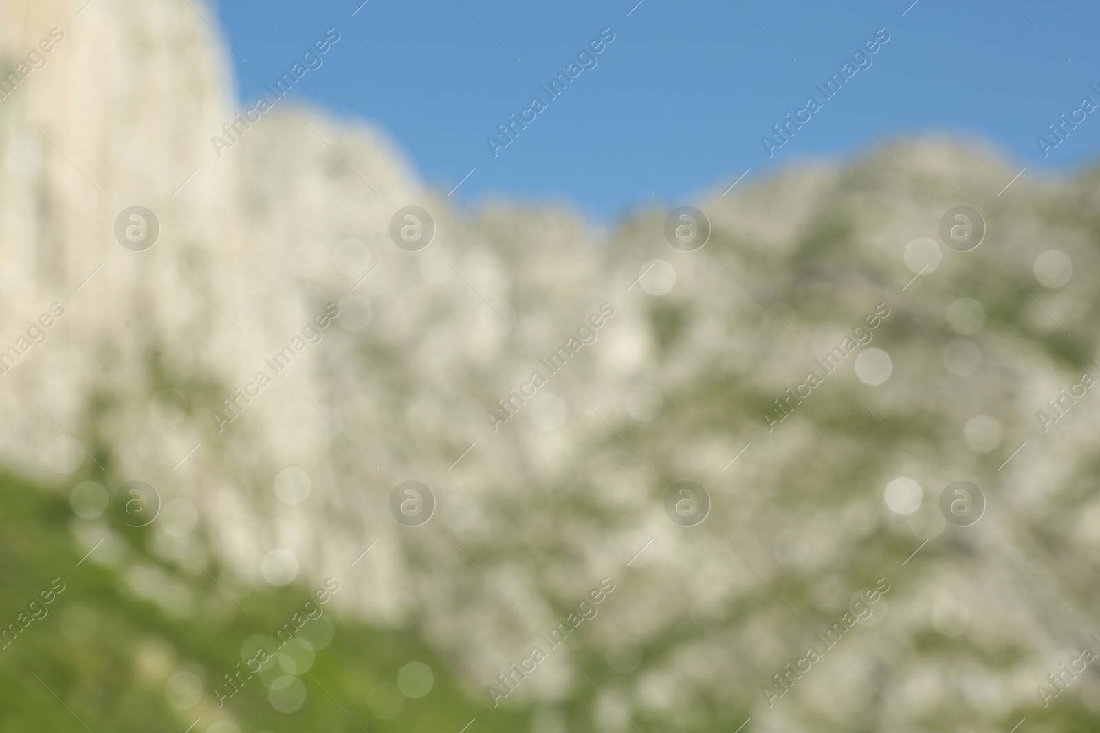 Photo of Blurred view of high mountains under sky outdoors