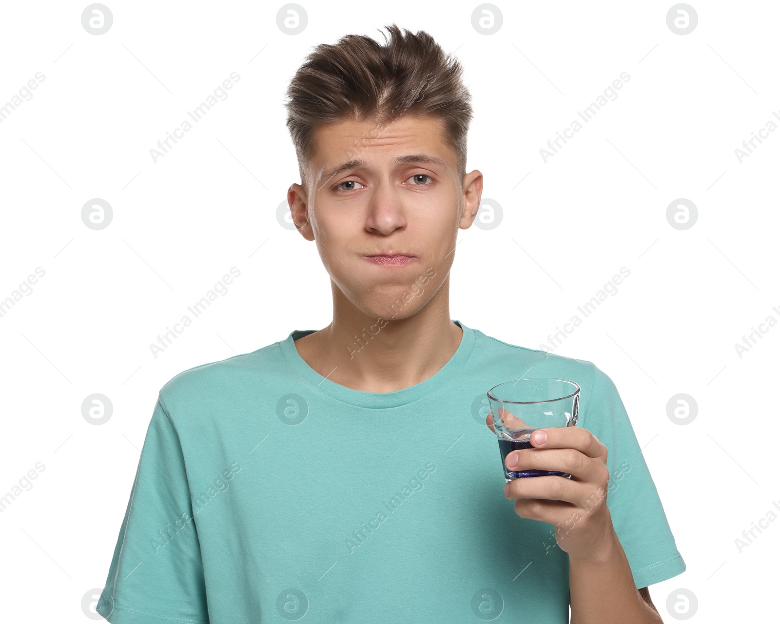 Photo of Young man using mouthwash on white background