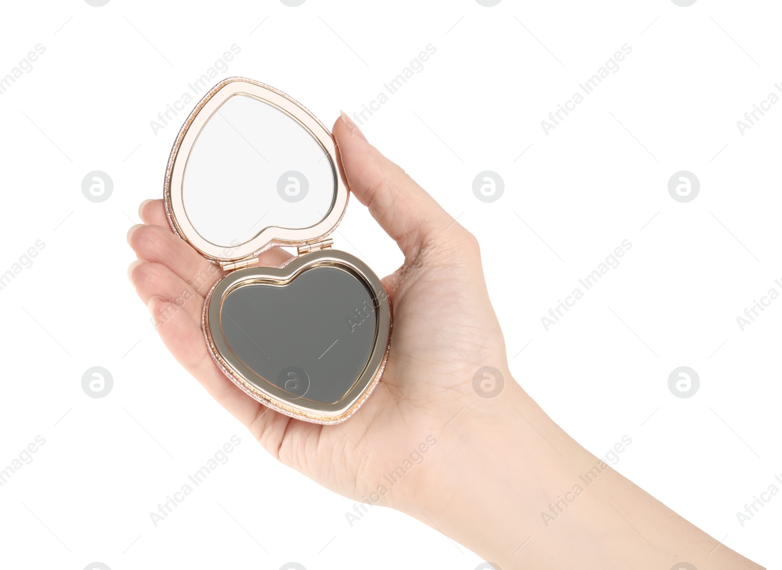 Photo of Woman holding stylish heart shaped cosmetic pocket mirror on white background, closeup