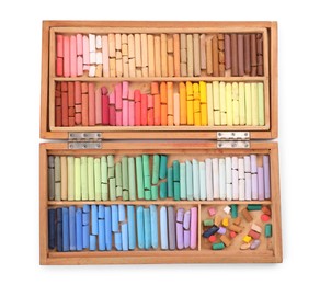 Photo of Set of soft pastels on white background in wooden box, top view. Drawing material