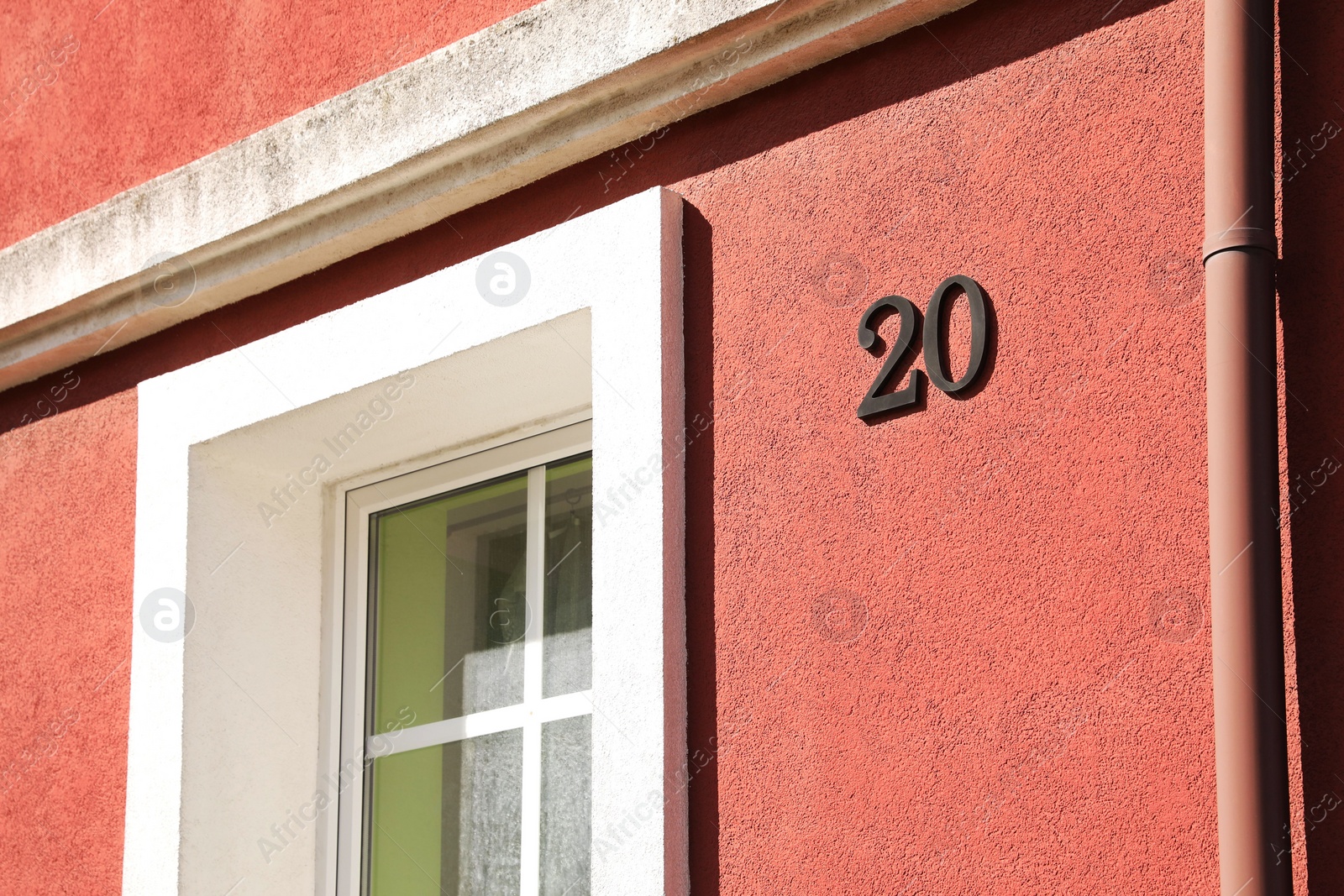 Photo of Number 20 on beautiful pink house outdoors